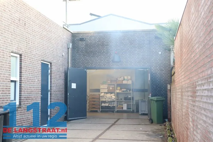 Brand in perscontainer bij Aldi Kaatsheuvel, woningen ontruimd 112 De Langstraat