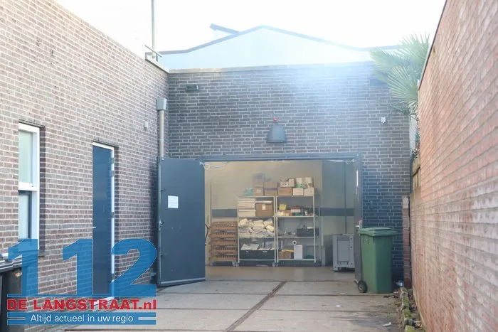 Brand in perscontainer bij Aldi Kaatsheuvel, woningen ontruimd 112 De Langstraat