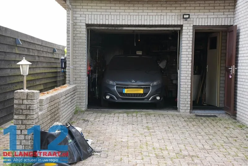 Brand in garage van woning aan Scharloo in Waspik, bewoonster naar ziekenhuis 112 De Langstraat